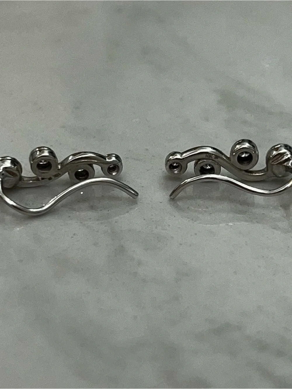 Diamond 10 Karat White Gold Wave Star Ear Climbers